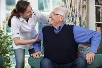 Older adult receiving practical in-home support from a professional caregiver in Atlanta