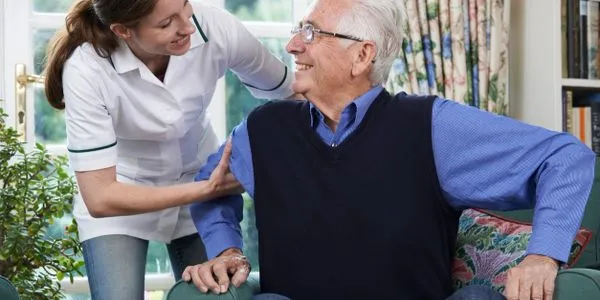 Caregiver and older adult sharing a warm moment